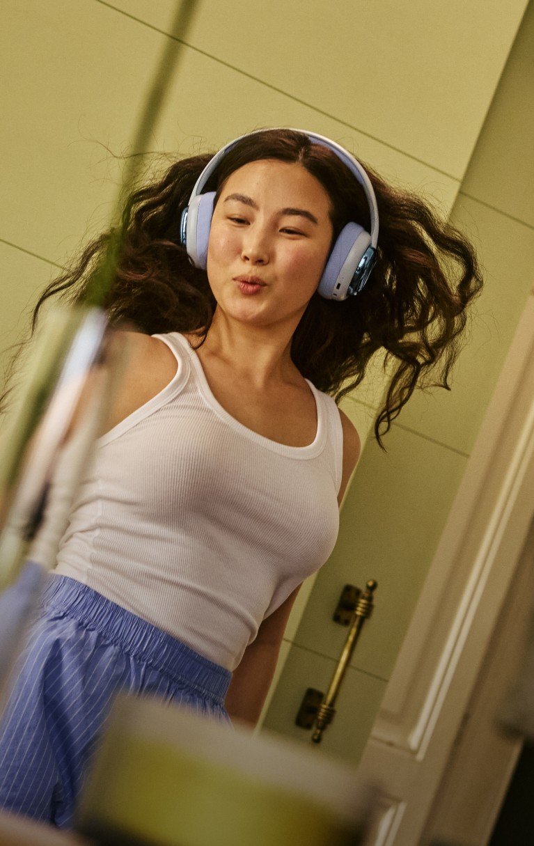 Woman dancing with headphones